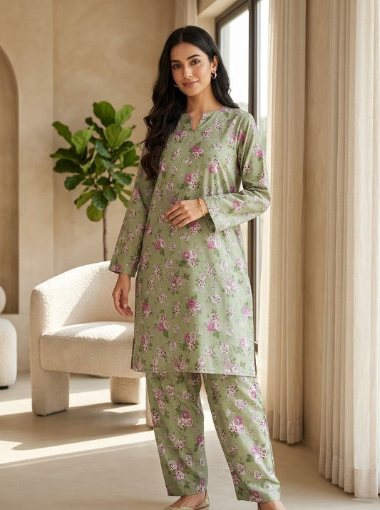 Model wearing sage green floral print 2-piece suit with matching kurta and trousers